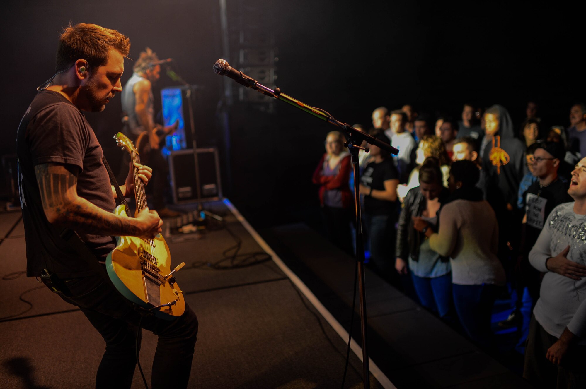 Joseph Milligan, a guitarist for Anberlin, performs during a concert in the Skelton Memorial fitness center at Spangdahlem Air Base, Germany, Sept. 22, 2014. Armed Forces Entertainment, Navy Entertainment and the 52nd Force Support Squadron hosted the complimentary concert for Airmen and their families. (U.S. Air Force photo by Airman 1st Class Kyle Gese/Released)