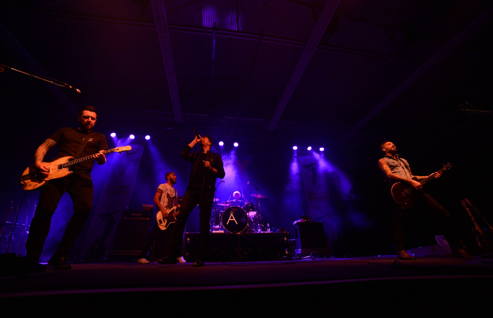 Florida-based band Anberlin plays a concert in the Skelton Memorial fitness center at Spangdahlem Air Base, Germany, Sept. 22, 2014. The free concert included a meet-and-greet session after the show.  Anberlin, formed in 2002, consists of guitarists Joseph Milligan and Cristian McAlhaney, lead vocalist Stephen Christian, bassist Deon Rexroat, and drummer Nathan Young. (U.S. Air Force photo by Airman 1st Class Kyle Gese/Released)