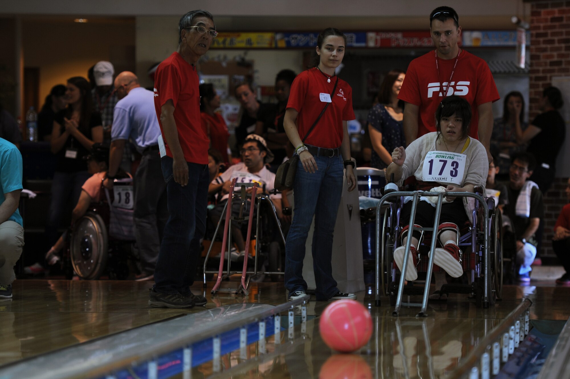 Nanami Tamayose, a Special Olympics athlete, watches her ball roll down a lane during a bowling competition at Seaside Bowl in Mihama, Japan, Sept. 20, 2014. The Kadena Special Olympics bowling competition is held a few weeks before the rest of the games in order to give athletes the opportunity to participate in as many events as possible. (U.S. Air Force photo by Airman 1st Class Zade C. Vadnais/Released)
