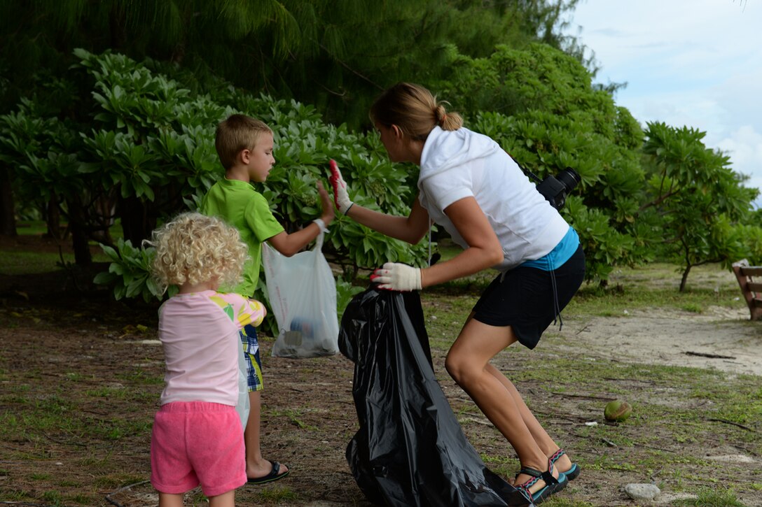 A team Andersen family participates in the International Coastal Cleanup Sept. 20, 2014 on Andersen Air Force Base, Guam. Nearly 100 volunteers joined together to remove several hundred pounds of trash and five trash bags full of recyclable items. (U.S. Air Force photo by Tech. Sgt. Zachary Wilson/Released.) 