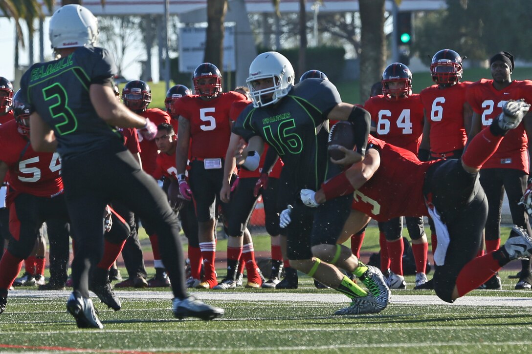 Marine Corps Base Spartans played against the Miramar Falcons during a Commanding General's Cup football game at the Paige Fieldhouse football field, Sept. 23. The Spartans defeated the Falcons with a score of 34-0. (Photo by Cpl. Shaltiel Dominguez)