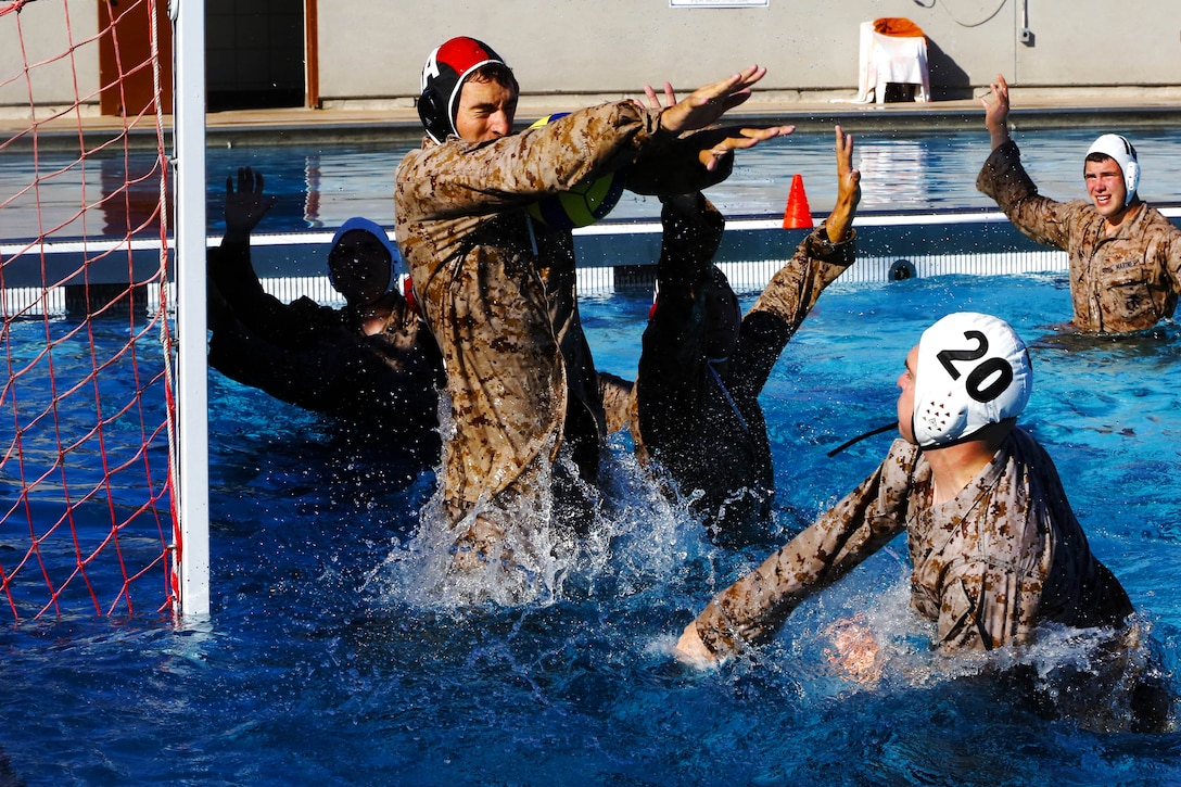 More than 50 Marines from various units came together to compete in the Combat Water Polo Tournament at the 13 Area pool, here, Sept. 24. The teams were comprised of seven to 10 Marines, each wearing boots and utilities while trying to claim first place.
