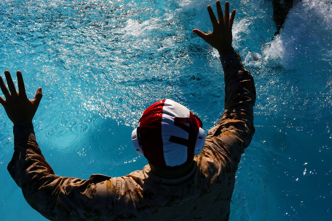 More than 50 Marines from various units came together to compete in the Combat Water Polo Tournament at the 13 Area pool, here, Sept. 24. The teams were comprised of seven to 10 Marines, each wearing boots and utilities while trying to claim first place.
