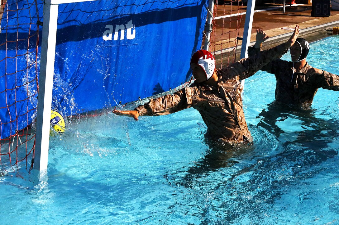 More than 50 Marines from various units came together to compete in the Combat Water Polo Tournament at the 13 Area pool, here, Sept. 24. The teams were comprised of seven to 10 Marines, each wearing boots and utilities while trying to claim first place.
