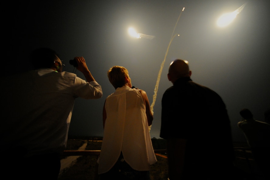Hurlburt Field group commanders, Honorary Commanders and local community members watch an AC-130U Spooky Gunship flare during a capabilities demonstration on Alpha 77 Range, Eglin Reservation, Fla., Sept. 19, 2014. Hurlburt inducted 11 new members into its Honorary Commanders Program, which strives to increase local community support and create an understanding of the Air Force’s role in today’s military. (U.S. Air Force photo/Staff Sgt. Sarah Hanson)