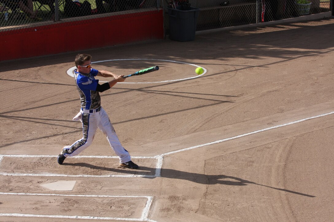 Air Force Senior Airman Terri Hodges smashes the ball for extra bases at the 2014 Armed Forces Womens Softball Championship
