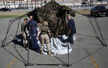 Marines and civilian contractors put together an Arctic shelter Aug. 29, 2014, aboard Camp Pendleton, California. The system is an ultra-lightweight, rapidly deployable shelter that offers military forces the necessary infrastructure to operate in austere cold-weather locations. The system is being used for training exercises in Bridgeport, California, and is slated to be integrated into exercises early next year. 