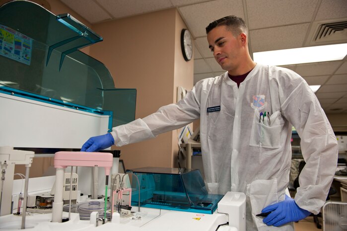 Senior Airman Anthony Potenzone, 99th Medical Support Squadron medical laboratory technician, performs a quality-control check on a chemistry analyzer at the Mike O’Callaghan Federal Medical Center at Nellis Air Force Base, Nev., Sept. 19, 2014. The chemistry section is responsible for handling 70 percent of the workload of the entire lab. (U.S. Air Force photo by Airman 1st Class Thomas Spangler)