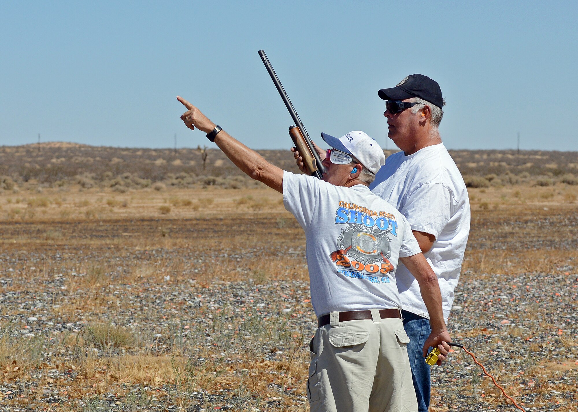 Jimmy Neal (left), Rod and Gun Club volunteer and lifetime member, assists Chuck Huggins, former Navy SEAL veteran, who had the opportunity to shoot skeet target presentations during a National POW/MIA Recognition Day activity at Edwards Sept. 19. During the day’s activities, the Air Force Sergeants Association Chapter 1328 sponsored 16 guests and a POW's spouse from the William J. "Pete" Knight Veterans Home for a tour of the base and the F-35 Integrated Test Force facility. (U.S. Air Force photo by Jet Fabara)