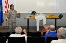 Senior Airman Tamika Bedasie, 9th Physiological Support Squadron, describes features of the full-pressure suit worn by U-2 pilots Sept. 22, 2014, at Beale Air Force Base, Calif.  Local civic leaders were invited on a tour of the base as part of the honorary commander program.  (U.S. Air Force photo by Staff Sgt. Brenda Davis/Released)
