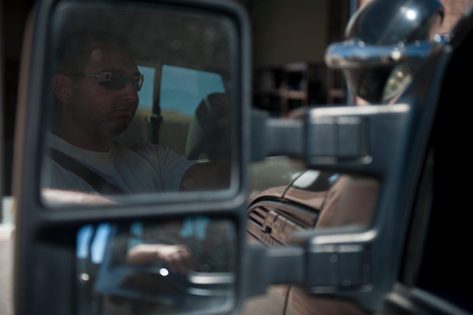 Senior Airman Miguel Vega, 57th Maintenance Squadron munitions line delivery crew chief, prepares to drive out to the flight line at Nellis Air Force Base, Nev., Sept. 19, 2014. After armed jets return from missions, ‘Line-D’ Airmen also perform reconciliations, or munitions inventories, to account for expended weapons and determine transport requirements for unused munitions off the flight line. (U.S. Air Force photo by Staff Sgt. Siuta B. Ika)