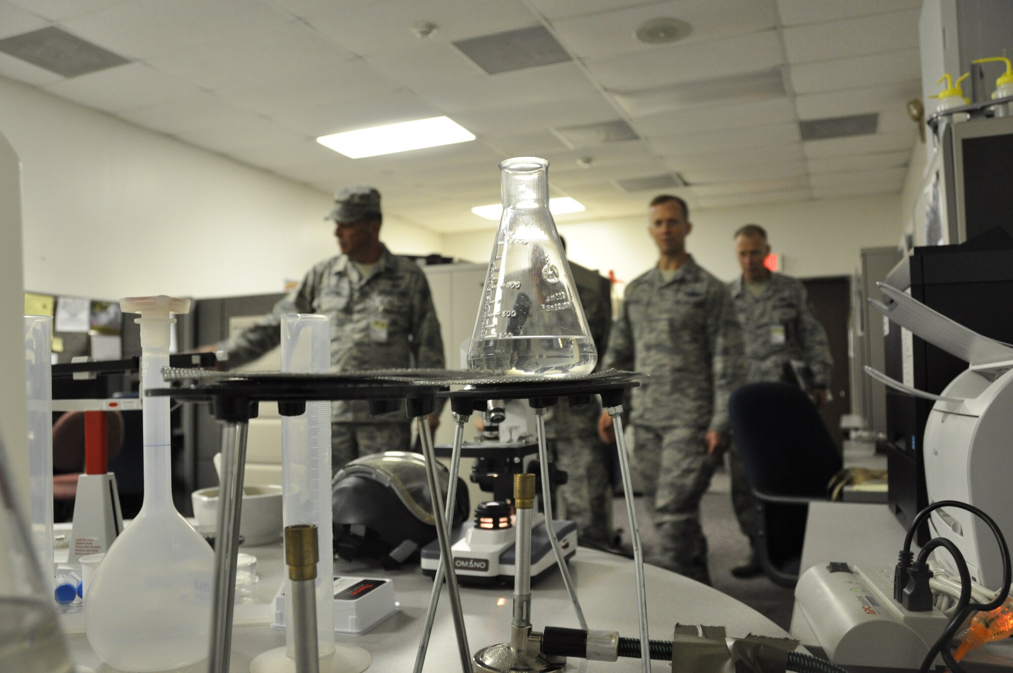 Col. Hubie Hegtvedt, commander of the 442d Fighter Wing, tours a simulated weapons lab during a disaster response exercise at Whiteman AFB, Mo. on September 21. The scenario involved players from five functional areas, including security forces, and simulated a shooter and a booby trapped ricin lab. (Air Force photo by Tech. Sgt. Emily F. Alley)