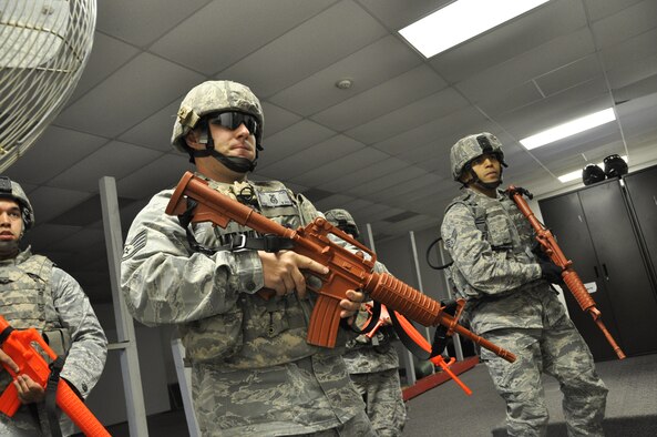 Members of the 442d Fighter Wing, Security Forces Squadron complete a building sweep while participating in a disaster response exercise at Whiteman AFB, Mo. on September 21. The scenario involved players from five functional areas, including security forces, and simulated a shooter and a booby trapped ricin lab. (Air Force photo by Tech. Sgt. Emily F. Alley)