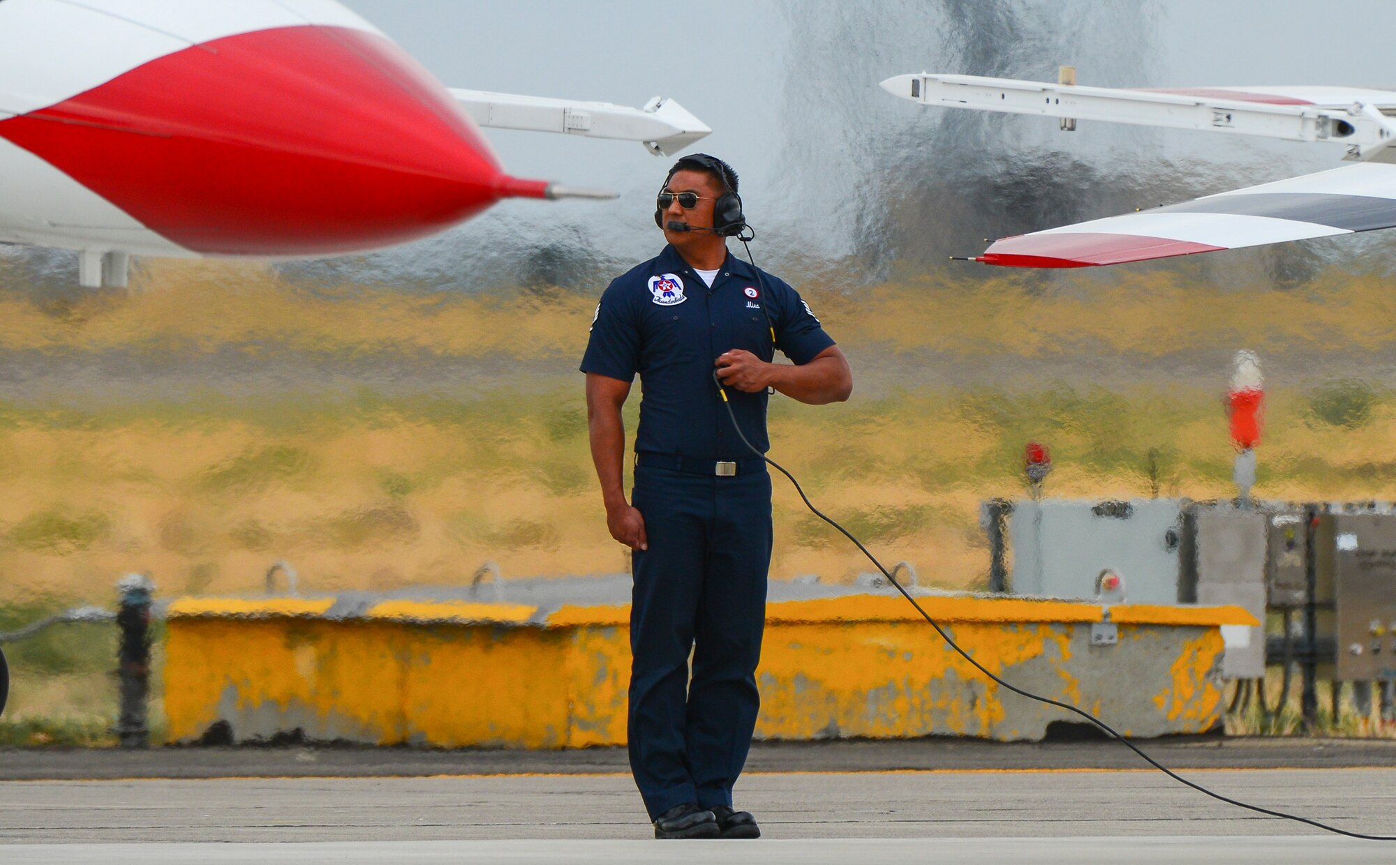 Staff Sgt. Mark Mira, U.S. Air Force Thunderbirds tactical aircraft maintainer, prepares Thunderbird eight for flight during the Gunfighter Skies 2014 air show at Mountain Home Air Force Base, Idaho, Sept. 21, 2014. Mira is one of the 120 support personnel assigned to the Thunderbirds. (U.S. Air Force photo by Airman Connor J. Marth/Released)