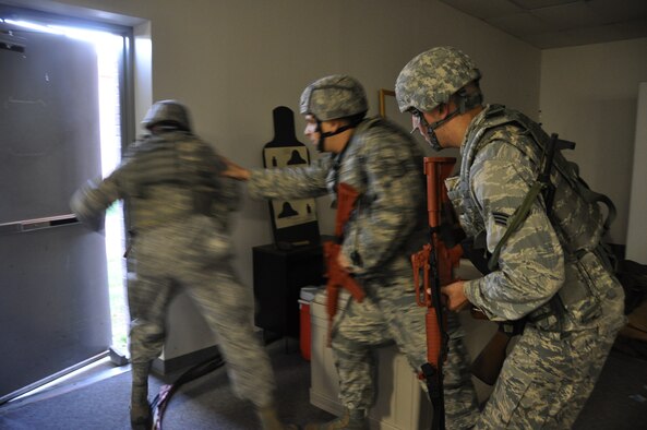 Members of the 442d Fighter Wing, Security Forces Squadron complete a building sweep while participating in a disaster response exercise at Whiteman AFB, Mo. on September 21. The scenario involved players from five functional areas, including security forces, and simulated a shooter and a booby trapped ricin lab. (Air Force photo by Tech. Sgt. Emily F. Alley)