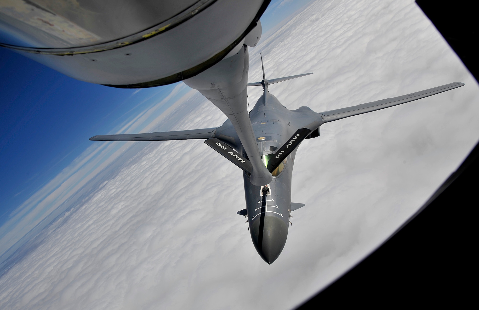 A KC-135 Stratotanker from Fairchild Air Force Base refuels a B-1B Lancer during a training exercise Sept. 23, 2014, over South Dakota. For more than 50 years the KC-135 has provided the core aerial refueling capability for the Air Force. The aircraft can travel up to 1,500 miles with 150,000 pounds of transfer fuel, which enables the Air Force to project rapid, flexible military power. The B-1B is assigned to Ellsworth Air Force Base, South Dakota. (U.S. Air Force photo by Senior Airman Mary O'Dell/Released)
