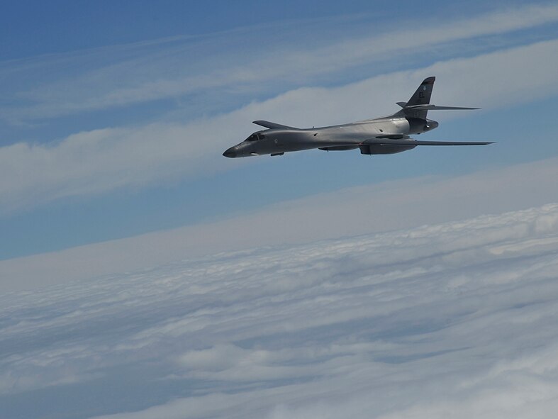A B-1B Lancer, assigned to Ellsworth Air Force Base, South Dakota, glides through the air over South Dakota, Sept. 23, 2014. Two B-1Bs participated in an aerial refueling training mission with a KC-135 Stratotanker assigned to Fairchild Air Force Base, Washington. The maximum fuel transfer load of the KC-135 is 200,000 pounds. (U.S. Air Force photo/Senior Airman Mary O'Dell)