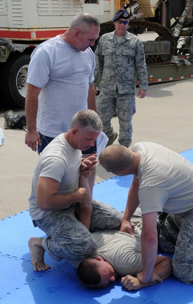 Members of the 188th Security Forces Squadron go through combative training at Ebbing Air National Guard Base, Fort Smith, Arkansas on Sept. 6, 2014. (U.S. Air National Guard photo by Airman 1st Class Cody Martin/Released)