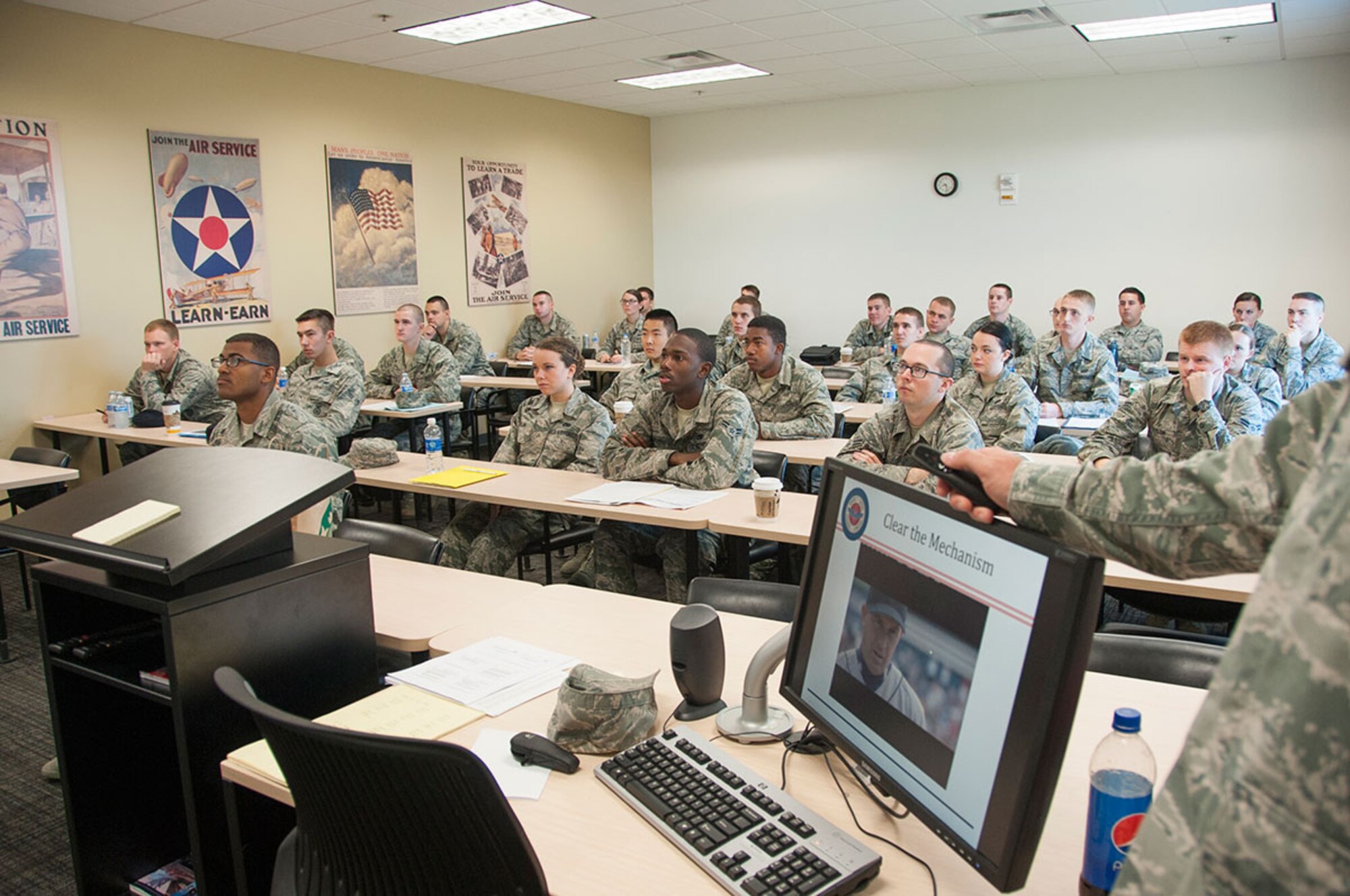 Airmen watch a motivational video during the First Term Airmen Course on Joint Base Elmendorf-Richardson, Alaska, Sept. 11, 2014. In FTAC, Airmen learn how to become familiar with the operational Air Force. (U.S. Air Force photo/Airman 1st Class Tammie Ramsouer)