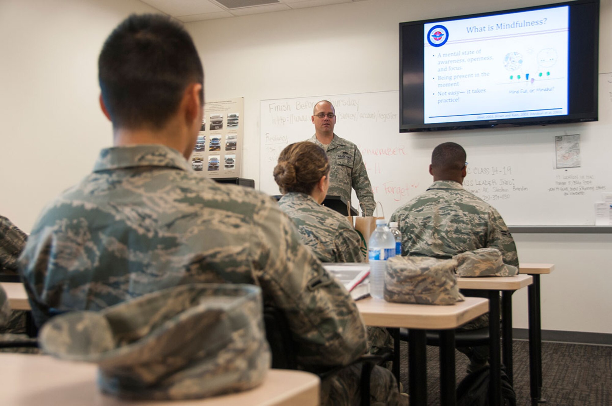 Tech. Sgt. Russel Benjamin, 90th Aircraft Maintenance Unit assistant section chief, briefs Airmen about resiliency during First Term Airmen Course on Joint Base Elmendorf-Richardson, Alaska, Sept. 11, 2014. The course prepares Airmen for the operational Air Force and the resources available to them on JBER. (U.S. Air Force photo/Airman 1st Class Tammie Ramsouer)
