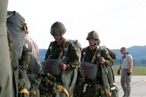 Air Force Tech. Sgt. Matthew Killen (right), a crew chief with the Kentucky Air National Guard’s 123rd Airlift Wing, performs a final debris check before a Kentucky C-130 Hercules takes off from Ramstein Air Base, Germany, on Sept. 5, 2014, carrying NATO paratroopers in support of Operation Saber Junction. The 123rd participated in the training exercise along with five other Air Guard units and troops from 17 NATO countries. (U.S. Air National Guard photo by 2nd Lt. James W. Killen)