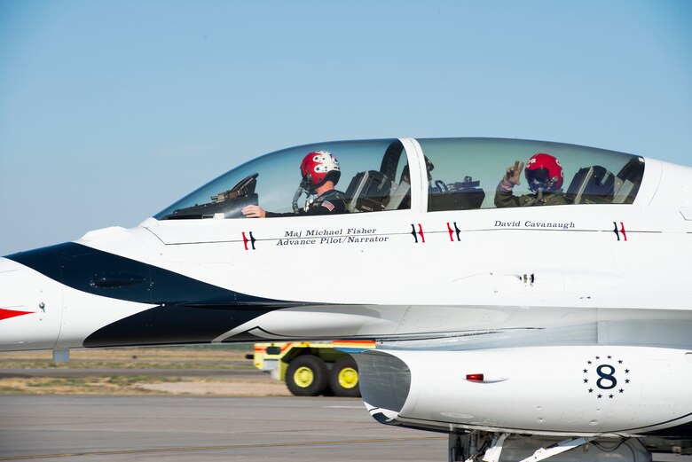 Sergeant David Cavanaugh, Boise police officer, waves to onlookers before take-off Sept. 19, 2014, at Mountain Home Air Force Base, Idaho. Working to help service members returning from deployments, Cavanaugh stresses the importance of community and base resources. (U.S. Air Force photo by Airman 1st Class Malissa Lott/RELEASED)