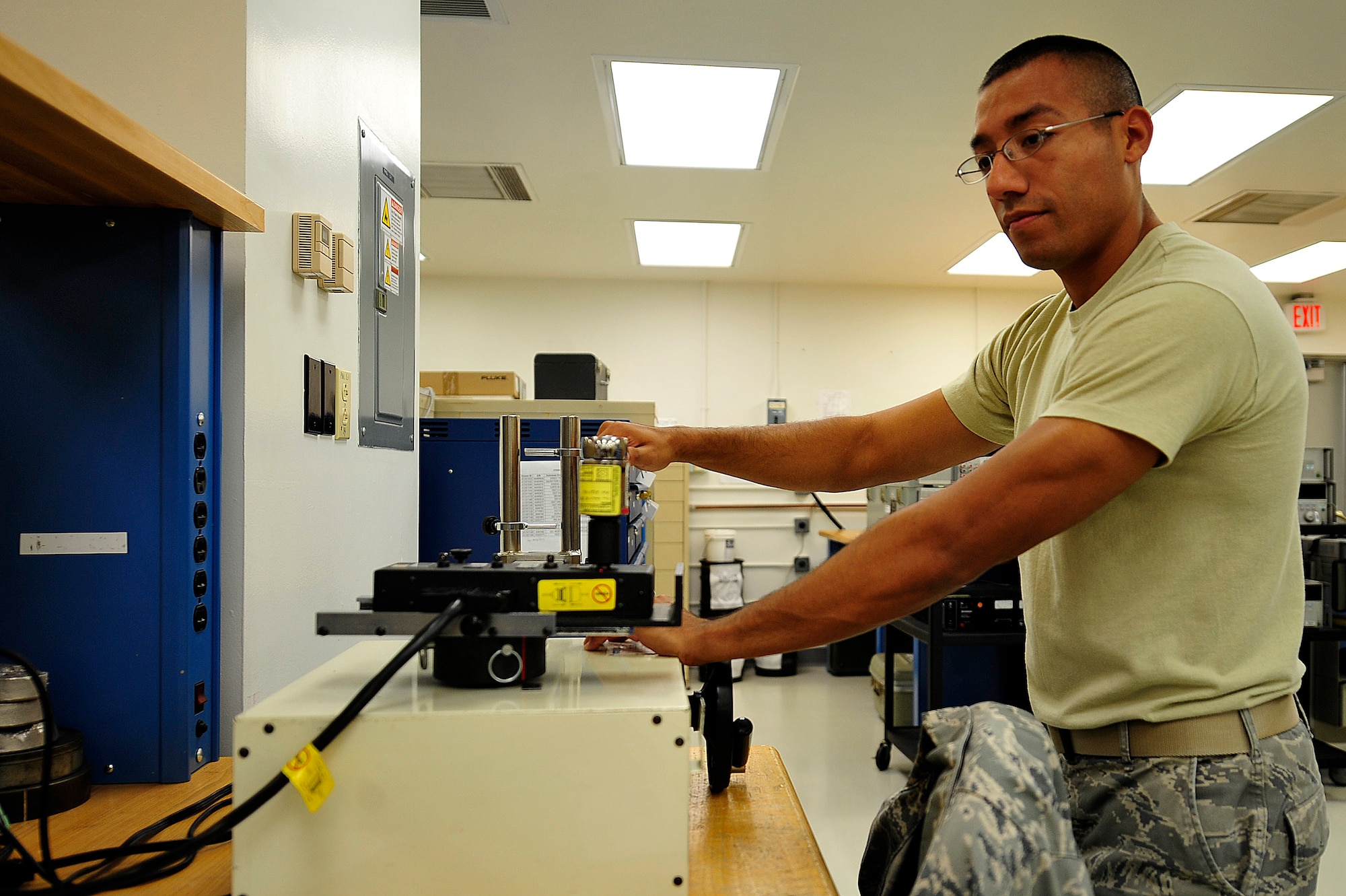 U.S. Air Force Staff Sgt. Danny Herrera, 1st Maintenance Squadron Precision Measurement Equipment Laboratory journeyman, uses a torque limiter at Langley Air Force Base, Va., Sept. 23, 2014. Torque limiters ensure technicians cannot over-tighten aircraft bolts. (U.S. Air Force photo by Airman 1st Class Breonna Veal) 