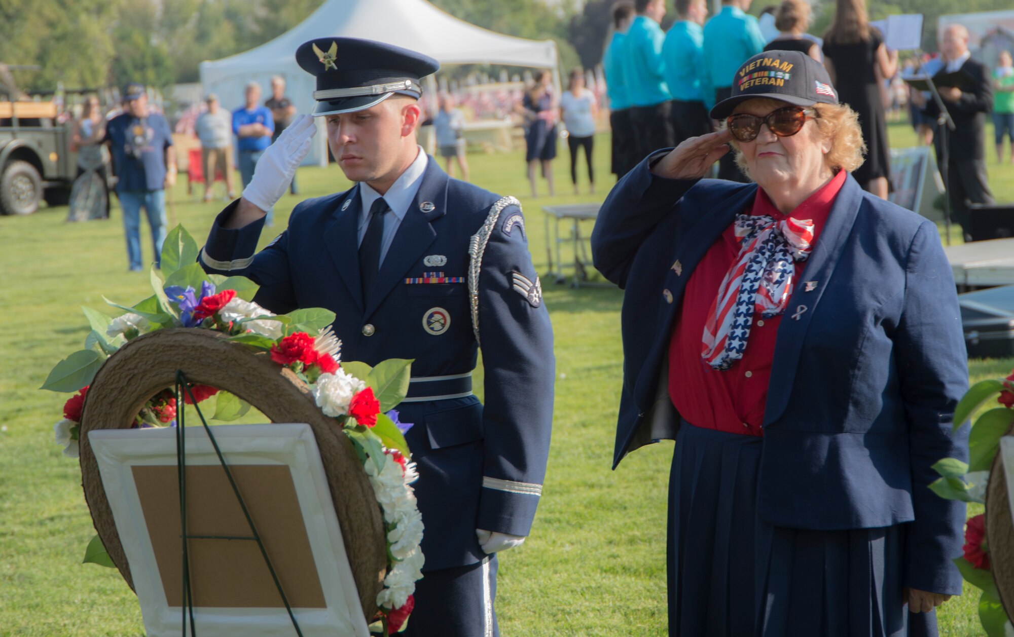 Senior Airman Alexander Young, 726th Air Control Squadron material control journeyman, laid a wreath alongside Linda Hawley a veteran who served during the Vietnam War at a wreath laying ceremony to honor the men and women who served in the Vietnam War in Boise, Idaho, Sept. 18, 2014. The 366th Fighter Wing Honor Guard laid wreaths alongside Vietnam veterans and members from the Army, Navy, Marines and Coast Guard. (U.S. Air Force photo by Staff. Sgt. Roy Lynch III/RELEASED)