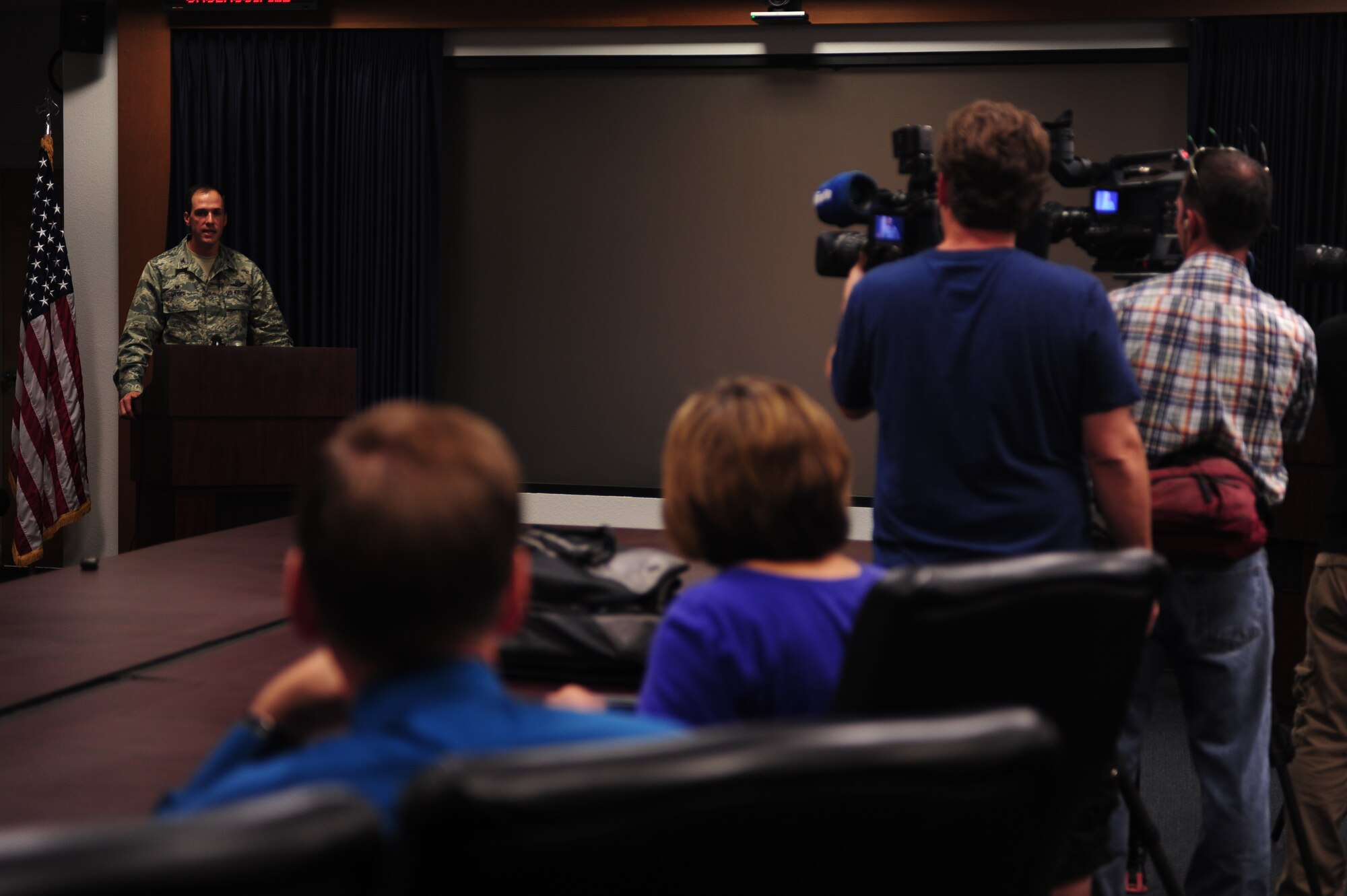 U.S. Air Force Col. James Meger, 355th Fighter Wing commander, addresses the media regarding the release of the revised draft Environmental Assessment for Total Force Training at Davis-Monthan AFB, Ariz., Sept 22, 2014.  The TFT assessment, formally known as the Operation Snowbird assessment, examines the environmental impacts of public safety, air quality, cultural resources, social economics, air space and noise in the local community. (U.S. Air Force photo by SSgt Courtney Richardson/Released)