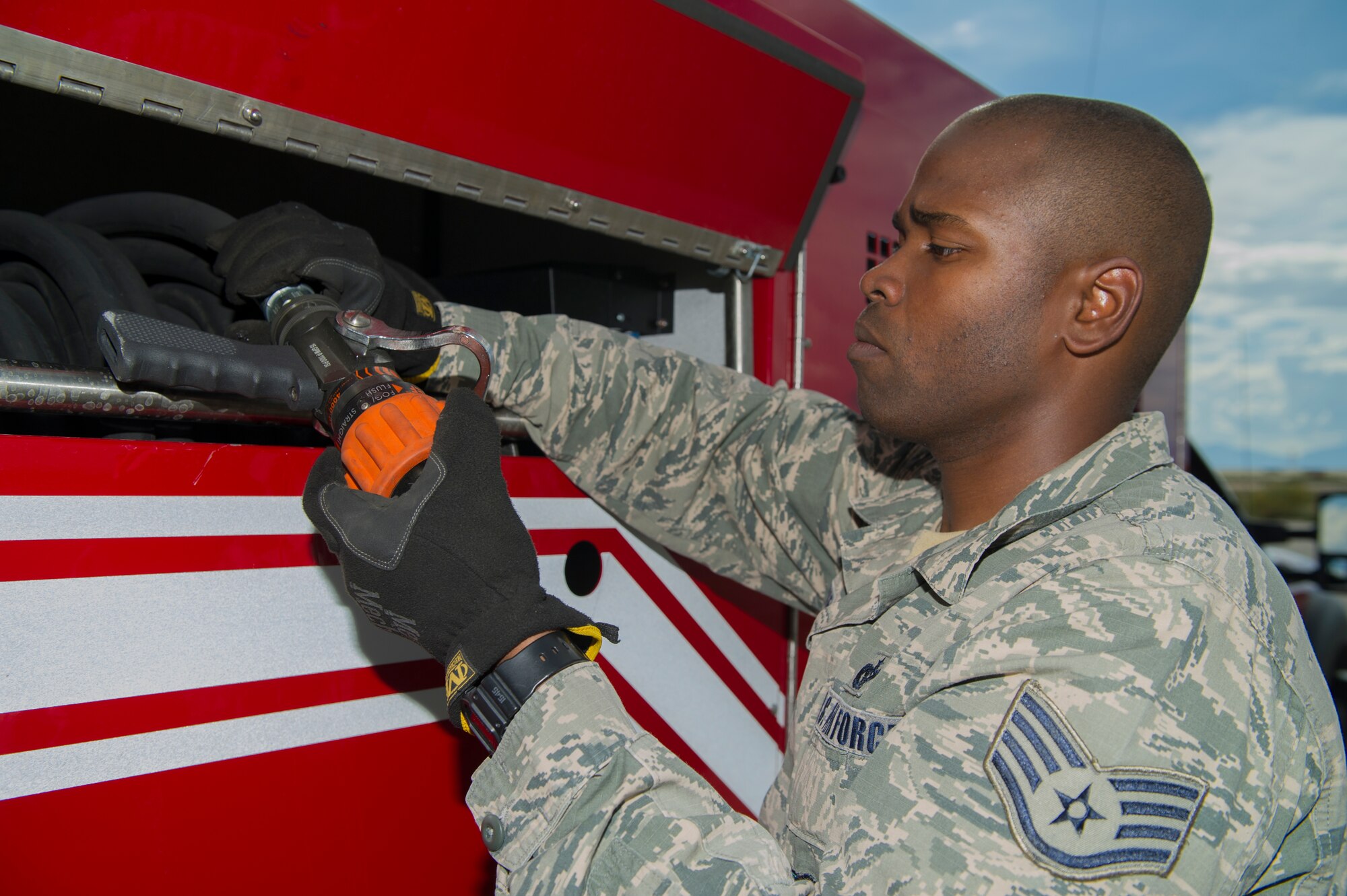Staff Sgt. Phillip Daniels, 49th Civil Engineer Squadron Fire Protection Flight firefighter, performs routine user maintenance on the new P-34 Rapid Intervention Vehicle at Holloman Air Force Base, N.M., Sept. 21. The RIV is three times more cost effective than the conventional firefighting vehicles. The combination of water and firefighting foam discharges at 1,350 pounds per square inch and increases the length of time that the RIV can remain on scene without having to be resupplied. Even though the RIV has a smaller capacity of 500 gallons, it has the firefighting capability of the larger 1,500 to 1,750 gallon vehicle at a cost that is significantly less. (U.S. Air Force photo by Airman 1st Class Aaron Montoya / Released)