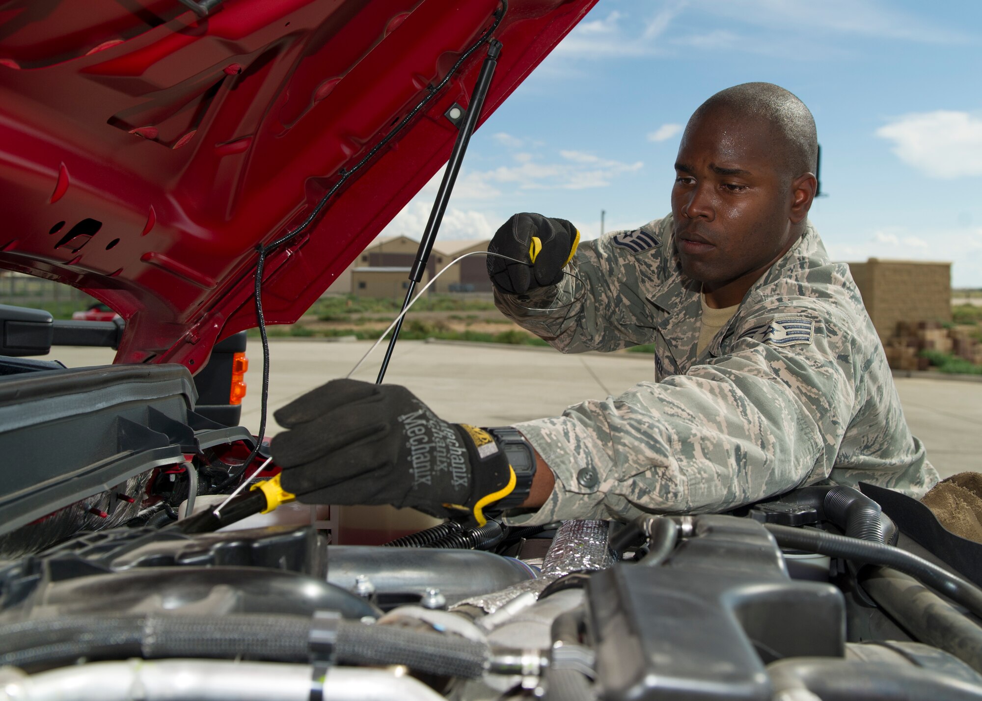 Staff Sgt. Phillip Daniels, 49th Civil Engineer Squadron Fire Protection Flight firefighter, performs routine user maintenance on the new P-34 Rapid Intervention Vehicle at Holloman Air Force Base, N.M., Sept. 21. The RIV is three times more cost effective than the conventional firefighting vehicles. The combination of water and firefighting foam discharges at 1,350 pounds per square inch and increases the length of time that the RIV can remain on scene without having to be resupplied. Even though the RIV has a smaller capacity of 500 gallons, it has the firefighting capability of the larger 1,500 to 1,750 gallon vehicle at a cost that is significantly less. (U.S. Air Force photo by Airman 1st Class Aaron Montoya / Released)