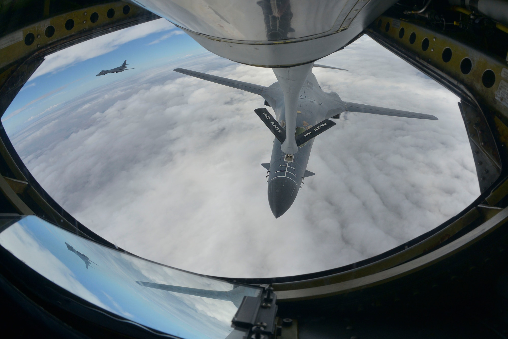 A KC-135 Stratotanker from Fairchild Air Force Base, Washington, refuels a B-1B Lancer during a training mission over South Dakota, Sept. 23, 2014. For more than 50 years, the KC-135 has provided the core aerial refueling capability for the Air Force. The B-1B is assigned to Ellsworth Air Force Base, South Dakota. (U.S. Air Force photo by Airman 1st Class Janelle Patiño/Released)
