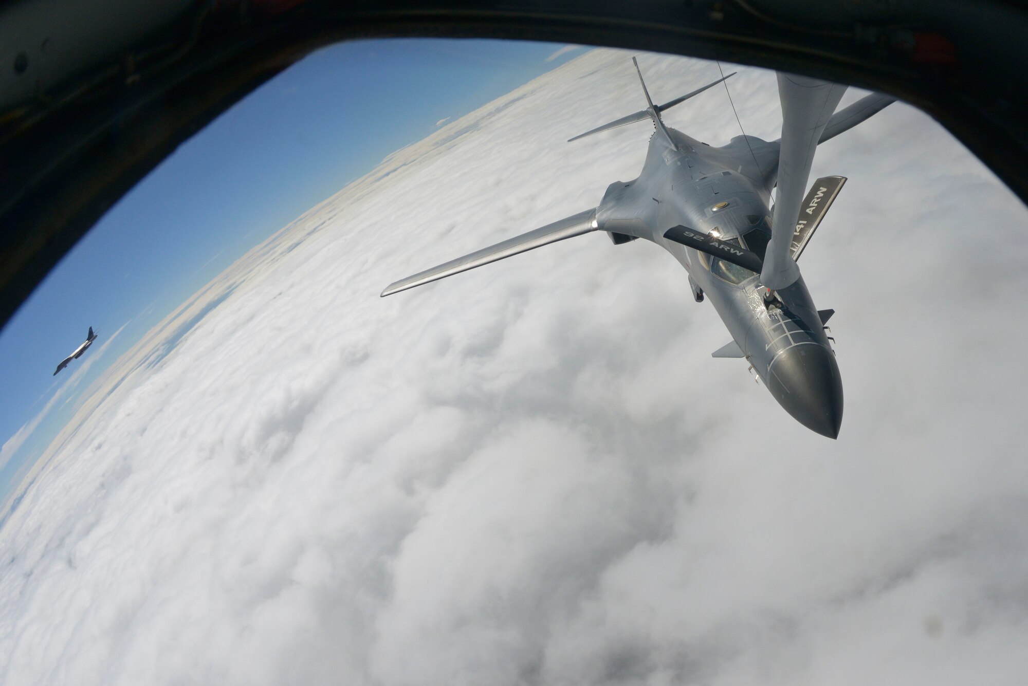 A B-1B Lancer, receives fuel from a KC-135 Stratotanker assigned to Fairchild Air Force Base over South Dakota, Sept. 23, 2014. During the flight, the crew performed training procedures with two B-1B's. The B-1B's are assigned to Ellsworth Air Force Base, South Dakota. (U.S. Air Force photo by Airman 1st Class Janelle Patiño/Released)