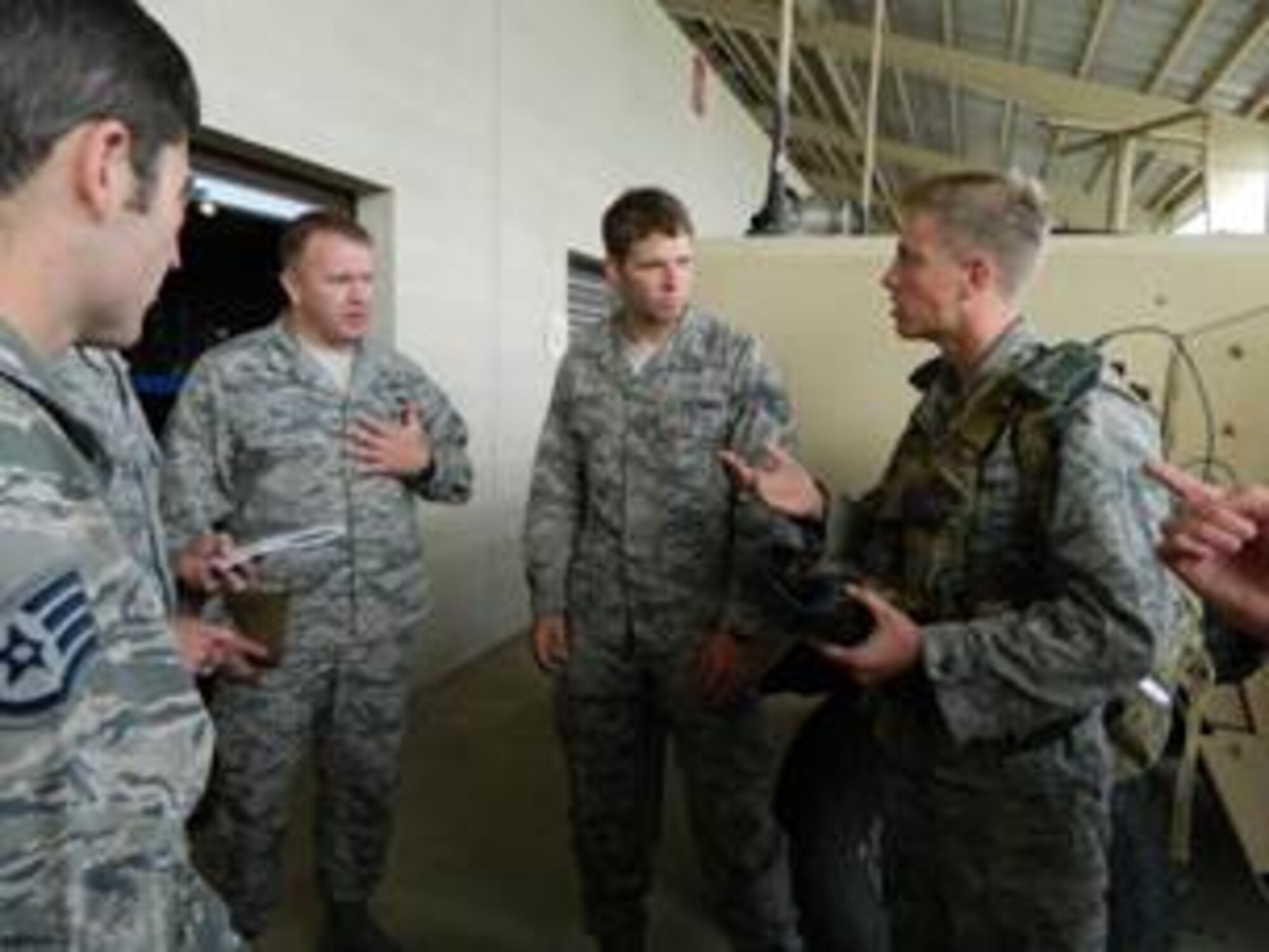 Cadets talk with 13th Air Support Operations Squadron TACPs about
battlefield Airman challenges for help with the design of their capstone
projects. The team of cadets represented two capstone projects underway to
help battlefield Airmen. The cooling system project has cadet designing a
lightweight, personal cooling system as part of an annual Air Force Research
Laboratory Service Academy Challenge. The other team is investigating
multi-modal and sensory wearable technology for battlefield Airmen to
enhance their information awareness and processing being developed by the
Battlefield Air Targeting, Man-Aided kNowledge, or BATMAN, program office.
(Courtesy photo)

