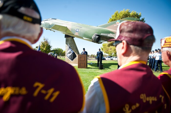 Attendees of the Prisoner of War and Missing in Action Recognition Ceremony listen to a speech by Col. Thomas E. Dempsey III, Nevada Test and Training Range commander, during the event at Nellis Air Force Base, Nev., Sept. 19, 2014. Dempsey spoke about the sacrifices all POW/MIA members made in defending the freedoms and liberties of the American people. (U.S. Air Force photo by Airman 1st Class Mikaley Towle)