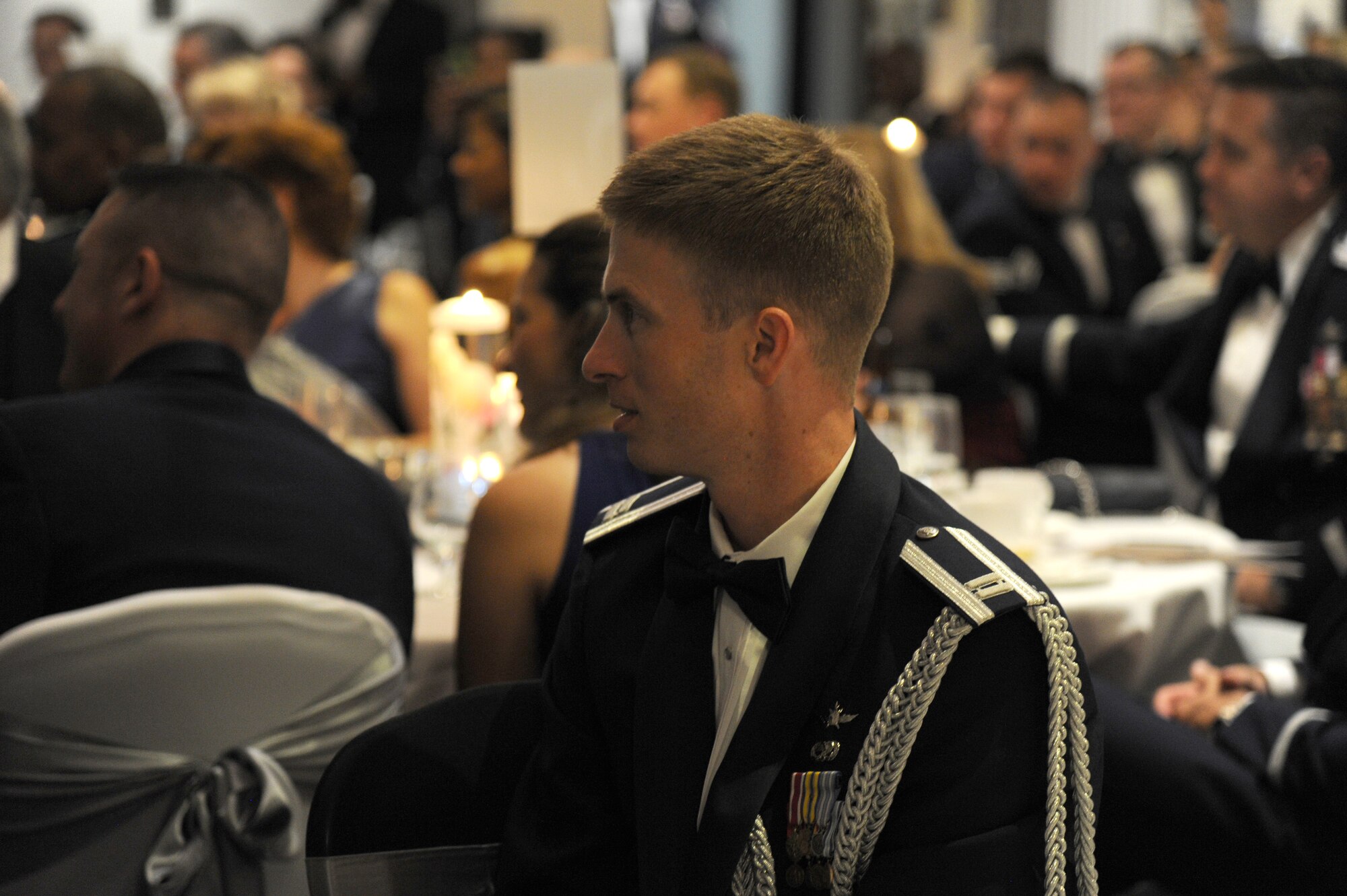 Capt. Jesse Ellis listens as the Airmen of Note perform during the Air Force District of Washington Air Force Birthday Ball at Joint Base Anacostia-Bolling, Washington, D.C., Sept. 19, 2014. Ellis is the AFDW aide-de-camp to the commander. (U.S. Air Force photo/Master Sgt. Tammie Moore)