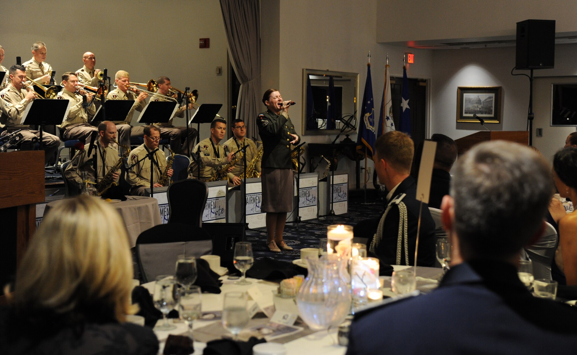 Tech. Sgt. Paige Martin sings as the Airmen of Note back her up during the Air Force District of Washington Air Force Birthday Ball at Joint Base Anacostia-Bolling, Washington, D.C., Sept. 19, 2014. The Airmen of Note, a jazz ensemble, is one of six musical ensembles that comprise the U.S. Air Force Band. Marin is the Airmen of Note vocalist. (U.S. Air Force photo/Master Sgt. Tammie Moore)
