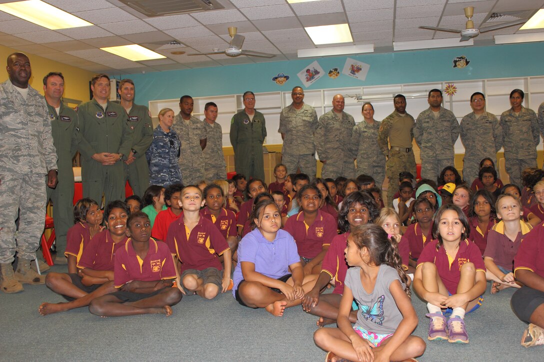 Members of the District of Columbia's Air National Guard's deployed 121st Expeditionary Fighter Squadron pose for a picture with McFarlane Primary School students in Katherine, Australia, during a visit, Sept. 17.  (U.S. Air National Guard photo/Airman 1st Class Aaron Church)