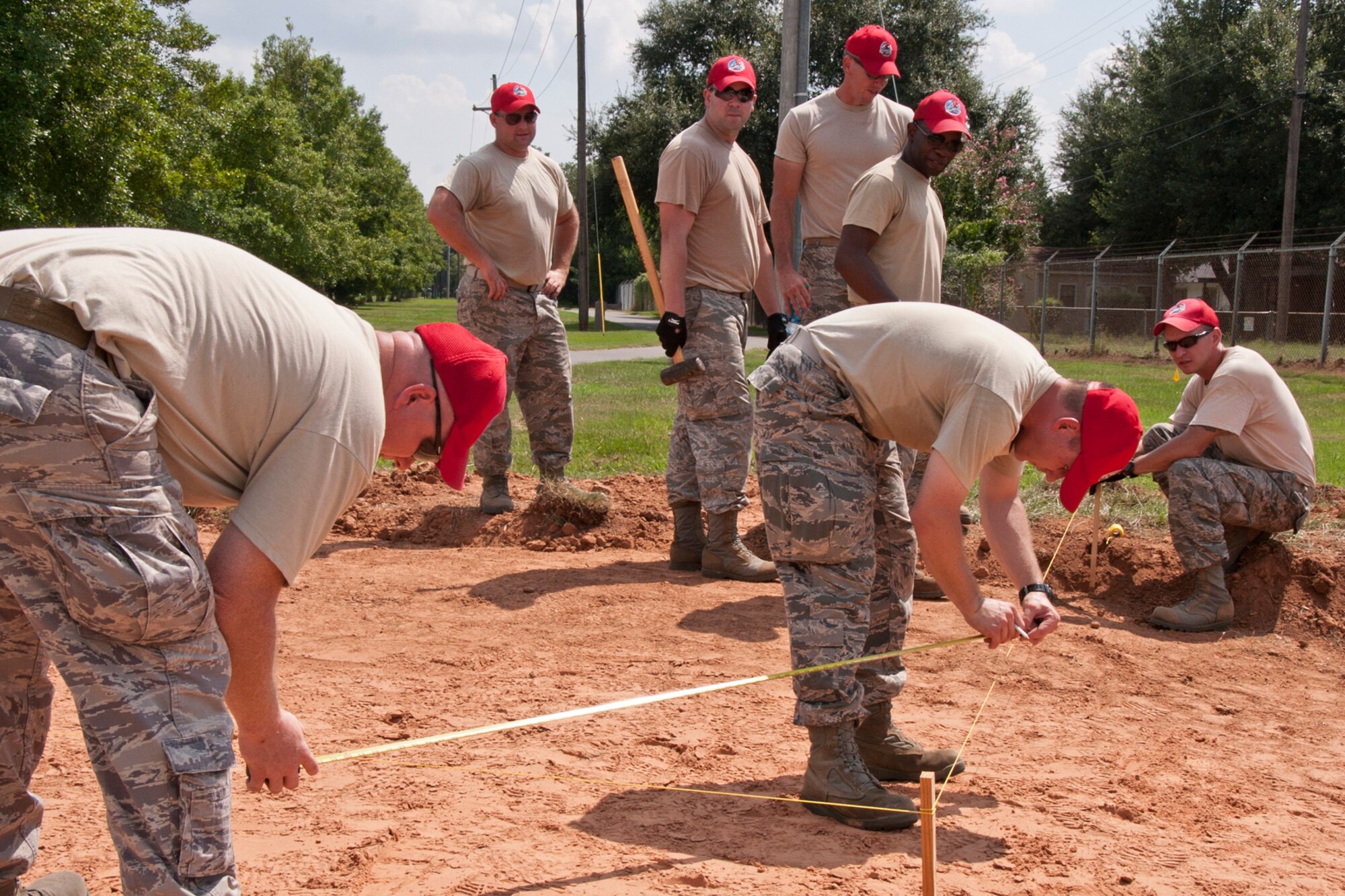 Members of the 307th RED HORSE construct forms for concrete at Barksdale Air Force Base, La., Sept. 8, 2014. A total of four slabs were poured Sept. 9, 2014, three for new athletic equipment along one of the running trails and one for parking at the 93rd Bomb Squadron building. (U.S. Air Force photo by Master Sgt. Jeff Walston/Released)