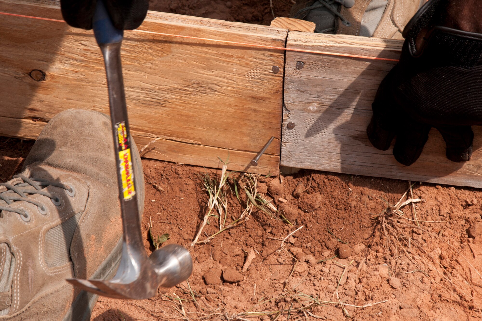 Members of the 307th RED HORSE construct forms for concrete at Barksdale Air Force Base, La., Sept. 8, 2014. A total of four slabs were poured Sept. 9, 2014, three for new athletic equipment along one of the running trails and one for parking at the 93rd Bomb Squadron building. (U.S. Air Force photo by Master Sgt. Jeff Walston/Released)