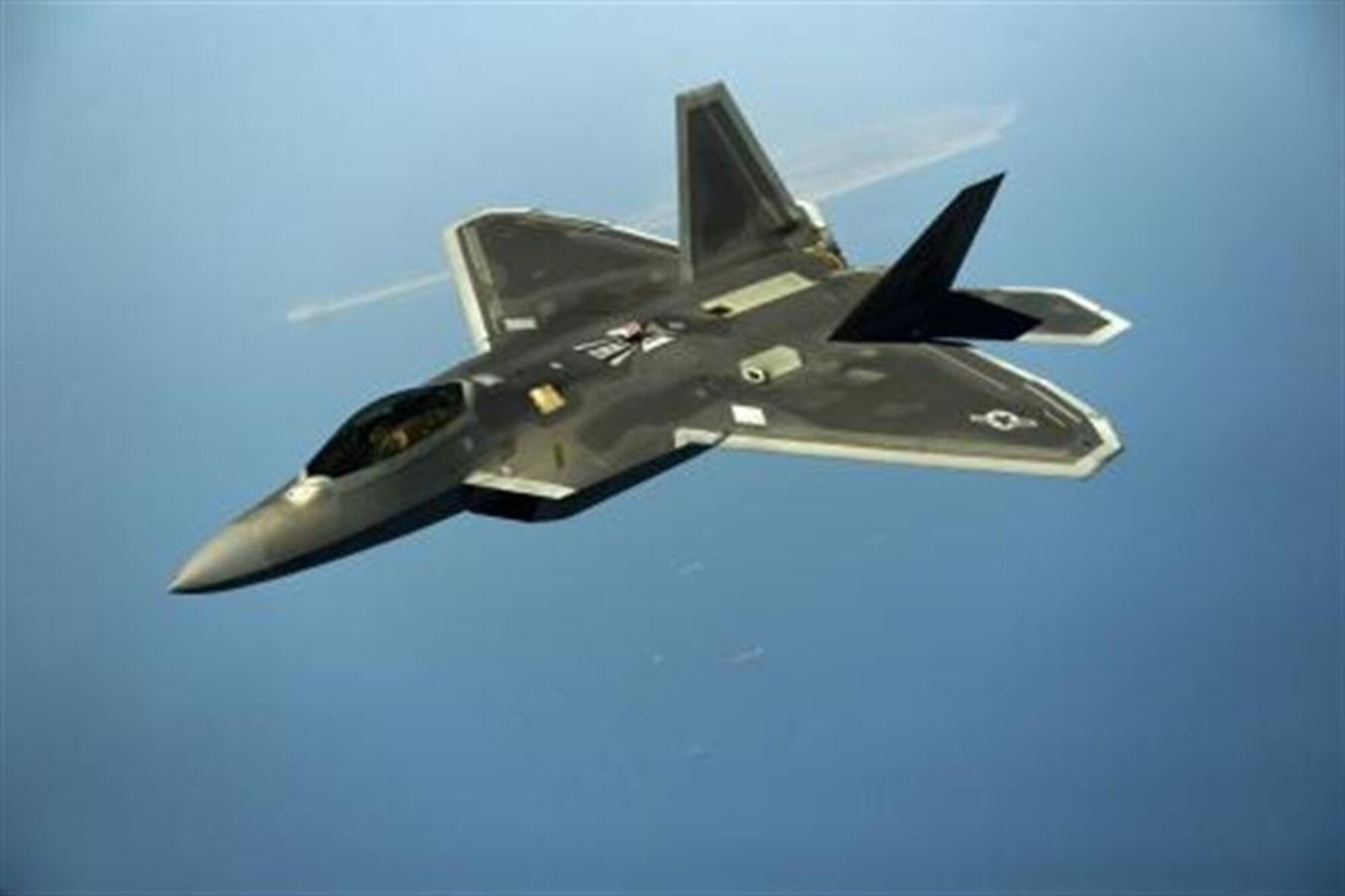 A U.S. Air Force F-22 maneuvers after being in-air refueled April 25, 2014, over the U.S. Central Command Area of responsibility by a KC-135 Stratotanker and aircrew from the 340th Expeditionary Air Refueling Squadron, Al Udeid Air Base, Qatar. The F-22 Raptor is an advanced capability aircraft that can be provided to the Combined Forces Air Component Commander within the region to enhance missions supporting stability and security. (U.S. Air Force photo by Staff Sgt. Vernon Young Jr.)