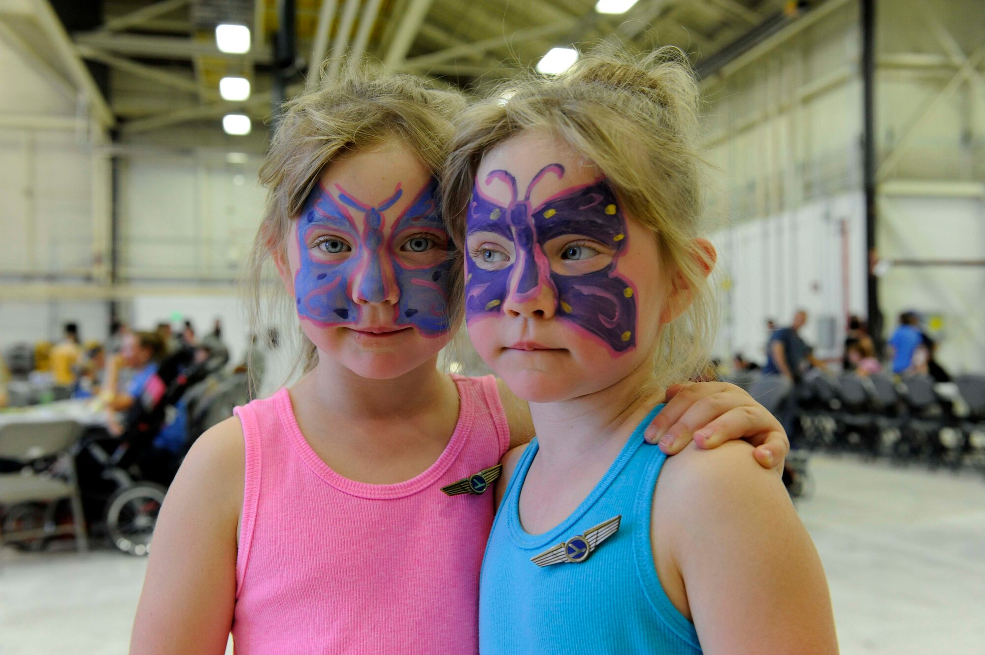 Emily and Elizabeth Morris, 5 year old twins, both got their faces painted, which prompted their younger twin sisters to do the same, at the Deployed Families’ Dinner in Hangar 210 on Sept. 19. The Deployed Families’ Dinner is held once a month for families to get together and have a little fun and a support system while their loved ones are overseas. (U.S. Air Force photo/Airman 1st Class Rose Gudex)