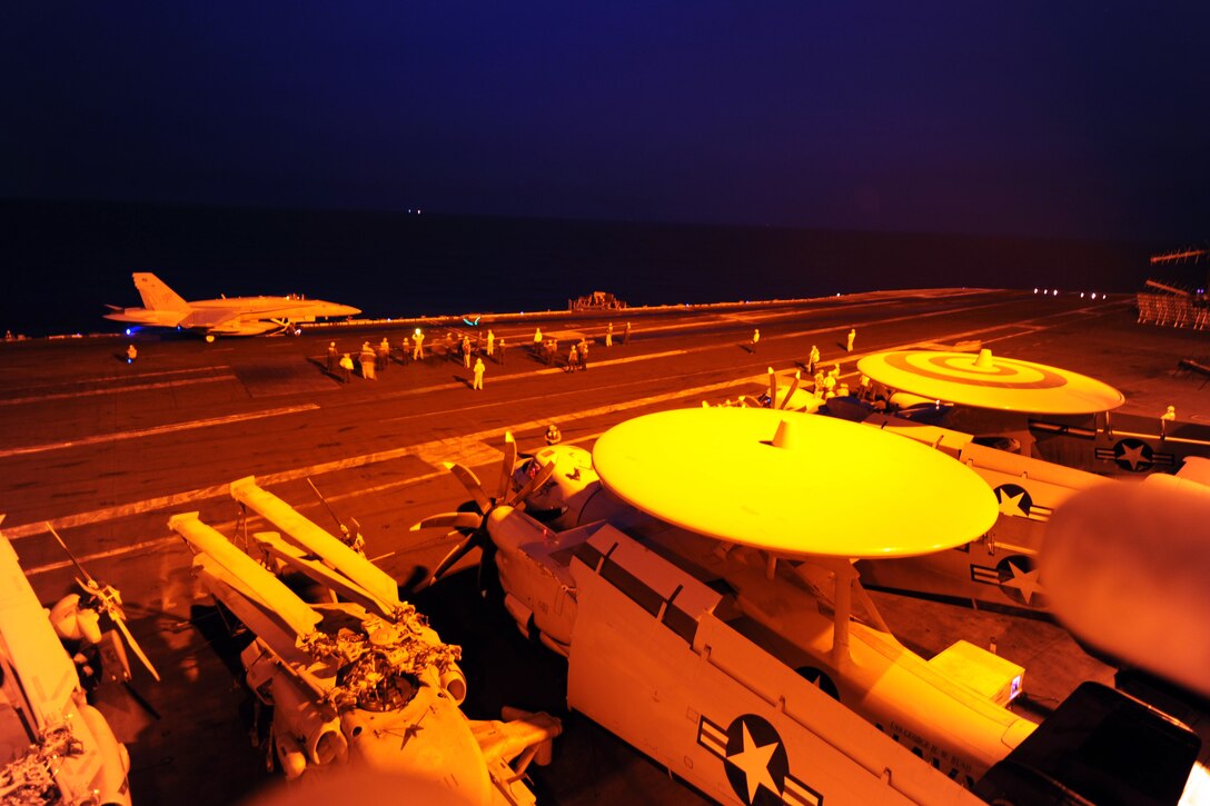 An F/A-18C Hornet attached to Strike Fighter Squadron 87 prepares to launch from the flight deck of the aircraft carrier USS George H.W. Bush in the Persian Gulf to conduct strike missions against Islamic State of Iraq (ISIL) targets, Sept. 23, 2014. The George H.W. Bush is supporting maritime security operations and theater security cooperation efforts in the U.S. 5th Fleet area of responsibility.