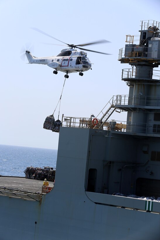 An SA-330J Puma lifts pallets from the flight deck of the USNS Amelia Earhart (T-AKE-6) for delivery to the three ship Makin Island Amphibious Ready Group (ARG) during a vertical replenishment at sea, Sept. 23. The 11th Marine Expeditionary Unit is deployed with the Makin Island ARG as a theater reserve and crisis response force throughout U.S. Central Command and the U.S. 5th Fleet area of responsibility. (U.S. Marine Corps photo by Sgt. Melissa Wenger/ Released)