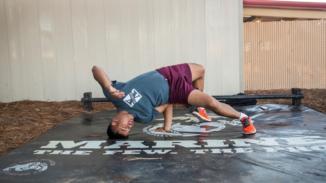 U.S. Marine Lance Cpl. Lance Allen T. Sanchez relieves stress by breakdancing aboard Camp Pendleton, Calif., Sept. 22, 2014. Sanchez, 21, is from Tamuning, Guam and is a food service specialist with 15th Marine Expeditionary Unit. (U.S. Marine Corps photo by Sgt. Emmanuel Ramos/Released)