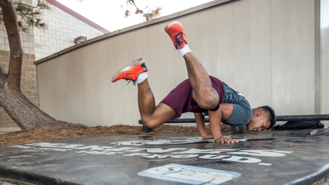 U.S. Marine Lance Cpl. Lance Allen T. Sanchez relieves stress by breakdancing aboard Camp Pendleton, Calif., Sept. 22, 2014. Sanchez, 21, is from Tamuning, Guam and is a food service specialist with 15th Marine Expeditionary Unit. (U.S. Marine Corps photo by Sgt. Emmanuel Ramos/Released)