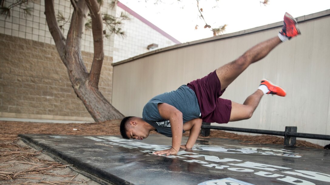 U.S. Marine Lance Cpl. Lance Allen T. Sanchez relieves stress by breakdancing aboard Camp Pendleton, Calif., Sept. 22, 2014. Sanchez, 21, is from Tamuning, Guam and is a food service specialist with 15th Marine Expeditionary Unit. (U.S. Marine Corps photo by Sgt. Emmanuel Ramos/Released)