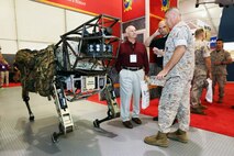 BGen Kevin Killea, director of the Futures Directorate and Commanding General of the Warfighting Lab, talks to retired LtGen Thomas Conant about the Marine Corps' recent work with the Legged Squad Support System (LS3)