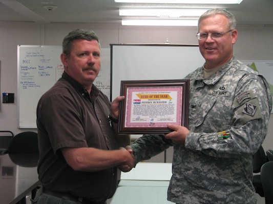 Jeffrey McMaster, resident engineer at the Fort Detrick Area Office, received the U.S. Army Corps of Engineers, Baltimore District, Hero of the Year award from District Engineer and Commander Col. Trey Jordan at a Sept. 16 ceremony. He earned the District award for his poise and professionalism following the August 2013 laboratory fire at the U.S. Army Medical Research Institute of Infectious Diseases replacement project. He provided accurate and timely reporting to Corps leaders in the aftermath of the incident.  