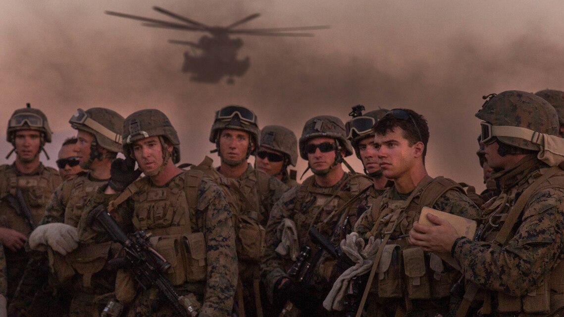 Marine Infantry Officer Course students await a CH-53E Super Stallion helicopter fast rope drill on the Marine Corps Air Station Yuma, Ariz., Auxiliary Landing Field 2, Wednesday, August 18, 2014. The fast rope training instilled in these Marines the skills necessary to complete IOC’s final exercise, Talon Reach IV.